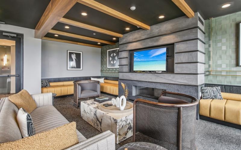 a living room with a tv and couches