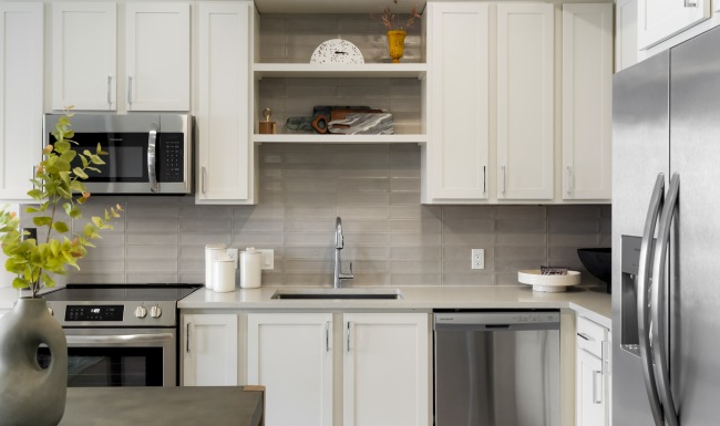 One bedroom apartment kitchen with stainless steel appliances and elevated finishes